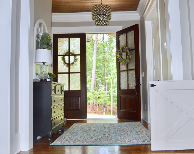 Foyer with double front doors. Double doors open to a beautiful foyer with v-groove plank ceiling. Ceiling: V-Groove Pine Plank finished with Minwax Stain in Provincial. Foyer with double front door. Foyer with double front doors. Foyer with double front door #Foyer #doublefrontdoors Home Bunch Beautiful Homes of Instagram @mygeorgiahouse