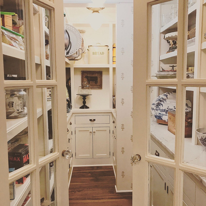 Kitchen Pantry door. Kitchen pantry with glass doors and glass knobs. Doors are salvaged from another old home - just painted in a white paint color - Benjamin Moore White Dove. #kitchenpantrydoor #pantrydoor Beautiful Homes of Instagram @SweetShadyLane