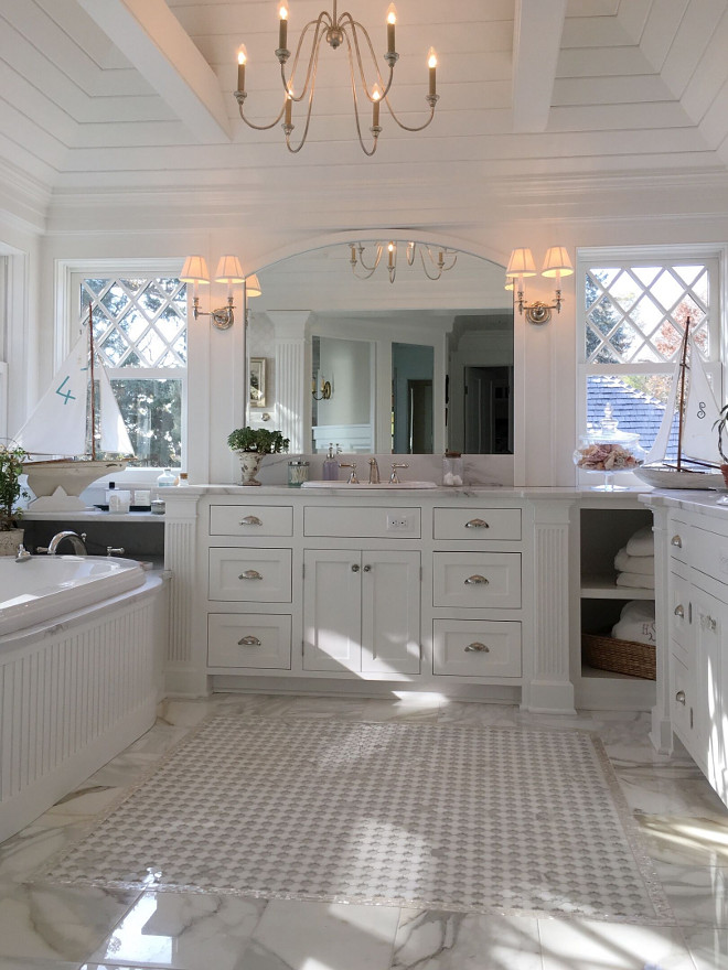 Master Bathroom. Classic master bathroom. White master bathroom with marble flooring. The master bath has diamond windows on both sides of vanity. It's white on white with marble floors #masterbathroom Beautiful Homes of Instagram @SweetShadyLane