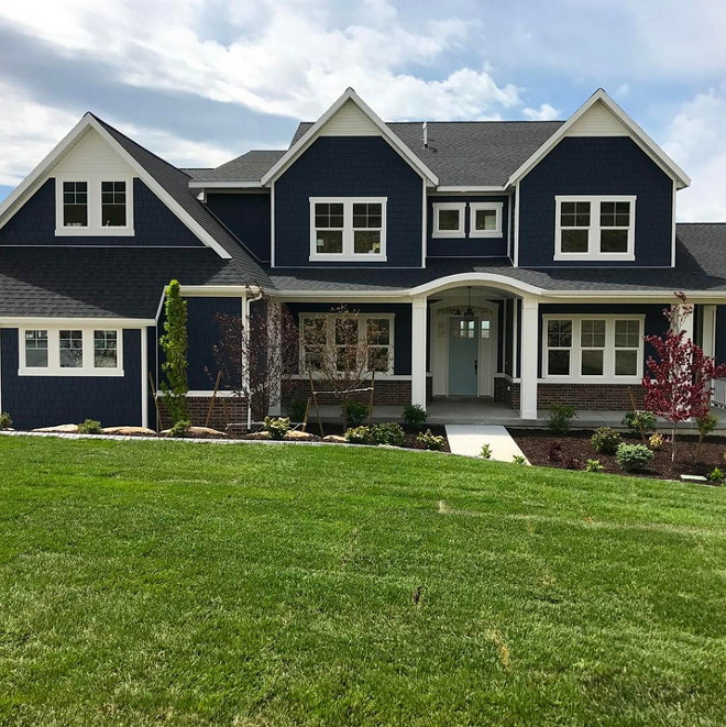 Navy exteriors. The navy exterior paint color is Benjamin Moore Hale Navy, the trim is Benjamin Moore Simply White, and the front door is Benjamin Moore Wedgewood Gray. Navy exteriors. Navy exteriors. Navy exteriors. Navy exteriors. Navy exteriors. Navy exteriors #Navyexteriors Millhaven Homes via @blueviewdrive