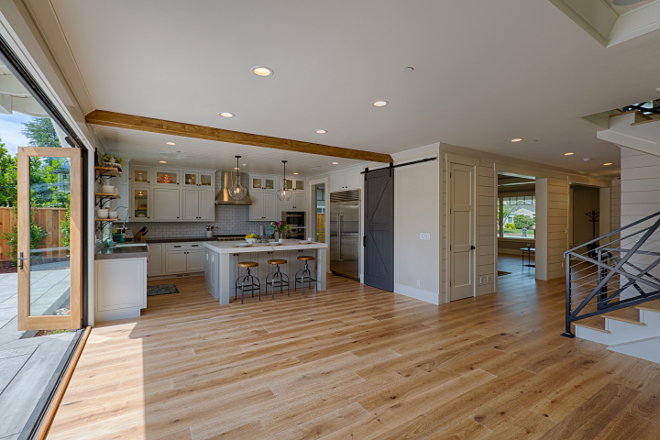 Open kitchen layout with hardwood floors on the entire main floor. AK Construction