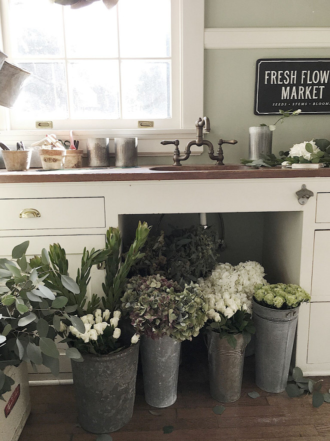 Farmhouse Butler's Pantry. In my years of flea market shopping I have acquired a lot of sets of vintage china so the pantry is perfectly suited for my many collections. The copper sink is original to the home as are the countertops and cabinets. Recently, I converted one end of the butler’s panty into a flower arranging station #farmhouse #butlerspantry Beautiful Homes of Instagram @my100yearoldhome