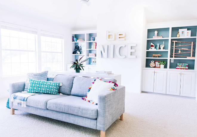 White Playroom painted in Benjamin Moore Simply White. White Playroom painted in Benjamin Moore Simply White. Cabinet Paint Colors: Benjamin Moore Moonshine, Benjamin Moore Gibraltar Cliffs (on the back wall of built-ins). #BenjaminMooreSimplyWhite Lark Interiors 