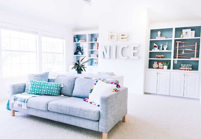 White Playroom painted in Benjamin Moore Simply White. White Playroom painted in Benjamin Moore Simply White. Cabinet Paint Colors: Benjamin Moore Moonshine, Benjamin Moore Gibraltar Cliffs (on the back wall of built-ins). #BenjaminMooreSimplyWhite Lark Interiors 