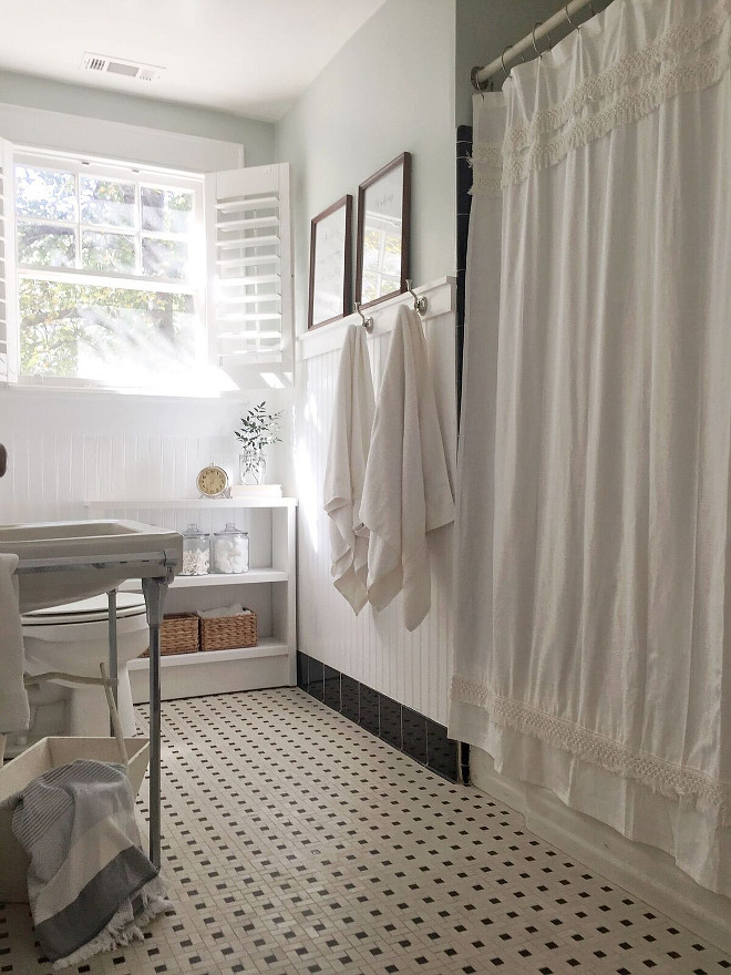 Bathroom Renovation Retro Bathroom renovation I kept our bathroom as original to the home as possible. I’m thankful for timeless styles like black and white tiles, because it allows for an updated look without having to spend a lot. I added the plantation shutters, beadboard, shelves and paint, but everything else is original. I had to get a little creative to cover the holes from the previous radiator - Rather than trying to patch the tile, I added the small bookcase to cover the patching #bathroom #renovation