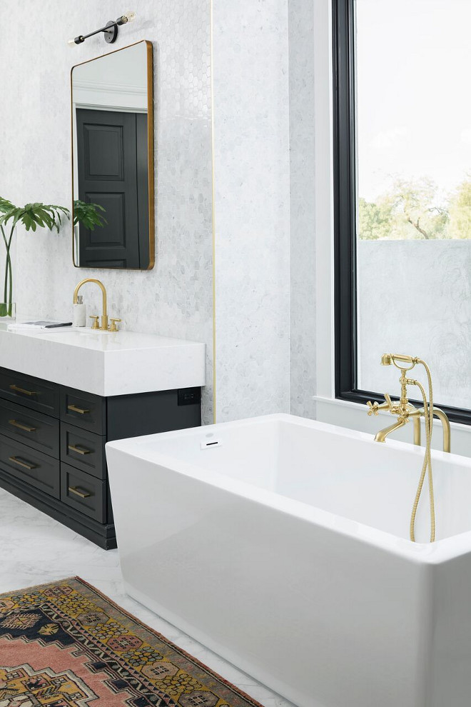 Bathroom with black and gold finishes. New trend black and gold. New interior design trend black and gold. #interiordesigntrends #blackandgold A Finer Touch Construction