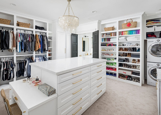 Closet with laundry machine. This spacious walk-in closet features a large island and laundry machines. Walk in Closet with laundry machine. Closet with laundry machine. Closet with laundry machine. Closet with laundry machine #Closetlaundrymachine A Finer Touch Construction