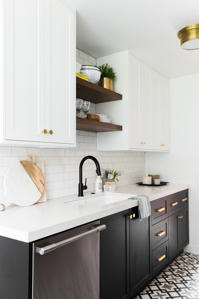 Countertop is white quartz. Backsplash is white subway tile with light grey grout