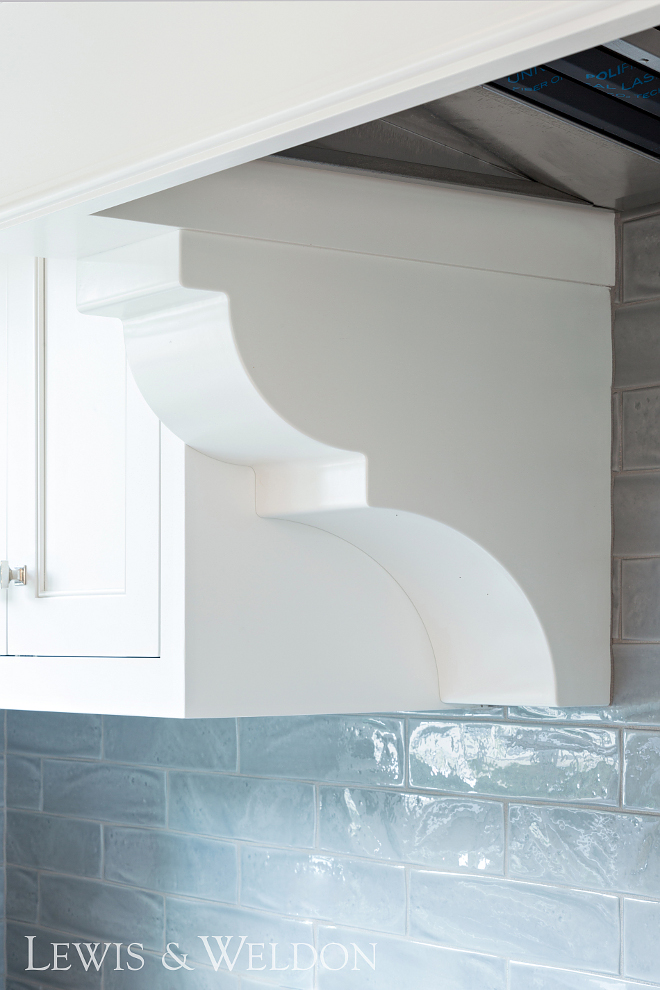 Custom Corbels Custom corbels flank a range top hood designed by Lewis & Weldon #customcorbels #corbels #hoodcorbels