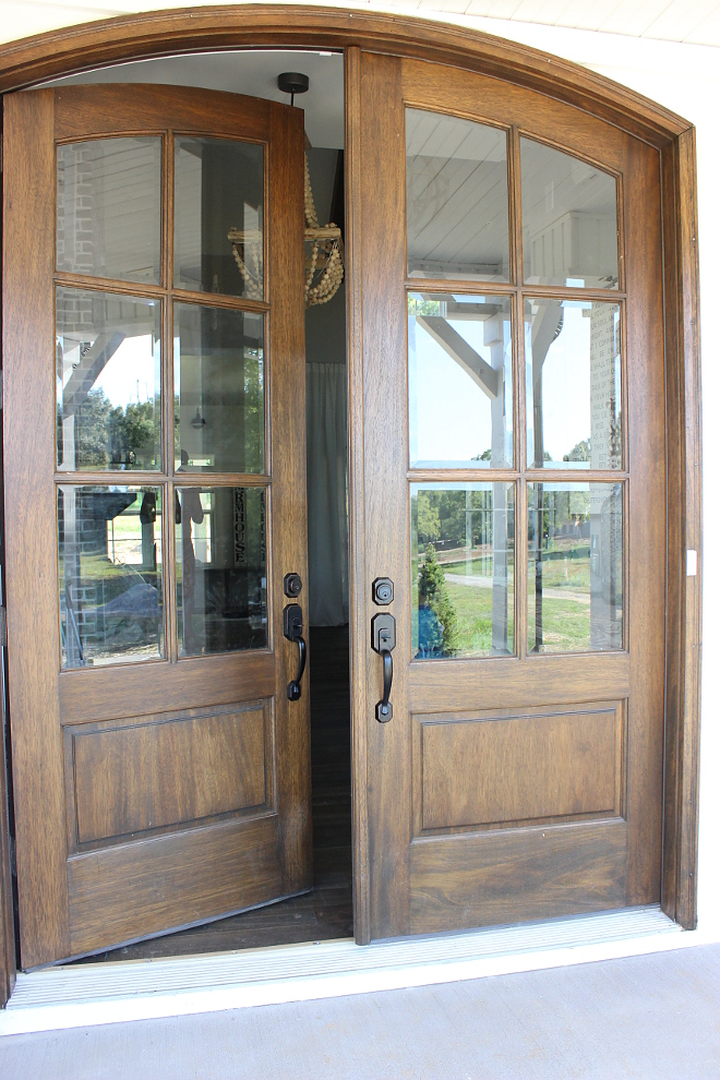 Double wood and glass arched front door with Oil-based stain by Sherwin Williams - Beautiful Homes of Instagram Home Bunch