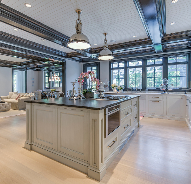 Grey kitchen island Grey island, The kitchen island was custom painted with a brushed finish in darker gray over a light gray to create a contrast to the white main cabinets #greyisland #greykitchenisland