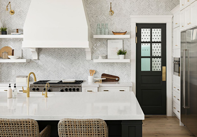 Kitchen with thick white quartz countertop, white marble herringbone backsplash and floating shelves flanking kitchen hood. The thick white quartz countertops are Cambria quartz. Kitchen with thick white quartz countertop, white marble herringbone backsplash and floating shelves flanking kitchen hood. Kitchen with thick white quartz countertop, white marble herringbone backsplash and floating shelves flanking kitchen hood. Kitchen with thick white quartz countertop, white marble herringbone backsplash and floating shelves flanking kitchen hood. Kitchen with thick white quartz countertop, white marble herringbone backsplash and floating shelves flanking kitchen hood #Kitchen #thickwhitequartzcountertop #quartzcountertop #whitemarbleherringbonebacksplash #herringbonebacksplash #floatingshelvesflanking #kitchenhood A Finer Touch Construction