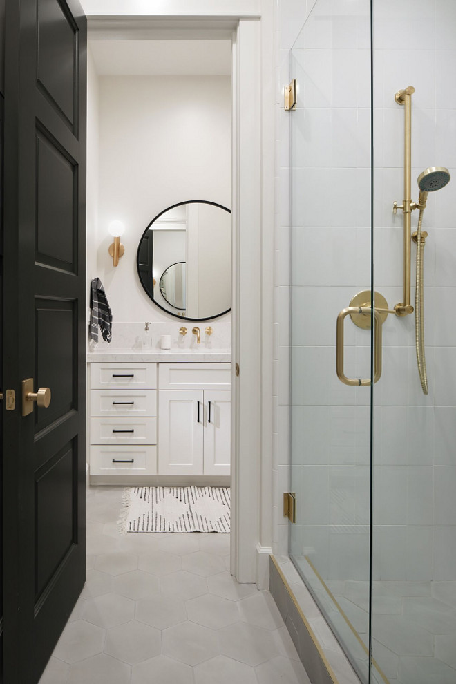 Modern Farmhouse Jack and Jill bathroom. Isn't this modern farmhouse Jack & Jill bathroom full of great ideas? I love the mix of gold and black and the grey hex floor tile. Modern Farmhouse Jack and Jill bathroom. Modern Farmhouse Jack and Jill bathroom. Modern Farmhouse Jack and Jill bathroom #ModernFarmhouseBathroom #farmhouseJackandJillbathroom #JackandJillbathroom A Finer Touch Construction