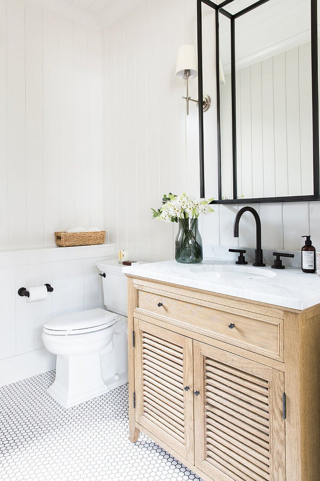 Neutral Farmhouse Bathroom with vertical shiplap, hex floor tile and Black metal mirror