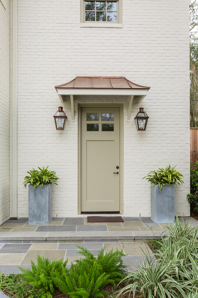 Off White Brick Exterior, The exterior features off white Off White/cream brick, copper roof details and exterior copper lanterns Pathway tile is natural Bluestone, Off White Brick Exterior with copper roof and copper exterior lanterns Off White Brick Exterior #OffWhiteBrickExterior #copperroof #copperlanterns