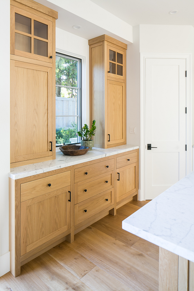 White Oak Kitchen Buffet Cabinet with white marble countertop and black hardware