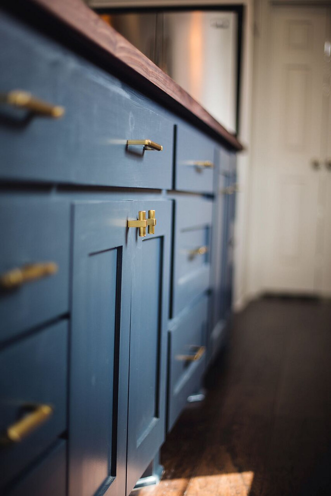 Navy cabinet with brass hardware Navy cabinet with brass hardware Navy cabinet with brass hardware This dark blue island makes the brass hardware come to life