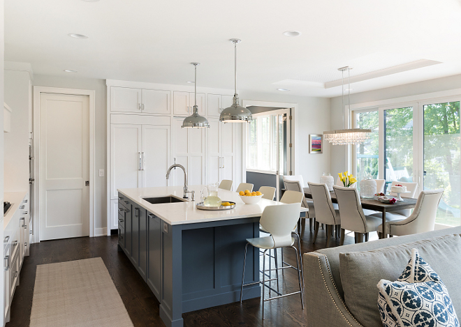 White kitchen with blue island Kitchen features white perimeter cabinets and a blue kitchen island