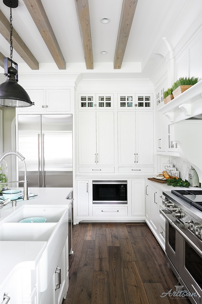 White Kitchen Dark Hardwood flooring and bleached ceiling beams