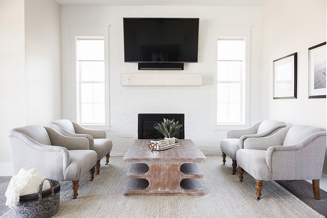 Painted brick accent wall The bedroom sitting area features a fireplace and painted brick accent wall