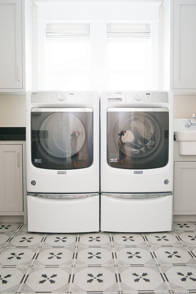 Pale grey cabinets The second floor laundry room features pale gray cabinets The second floor laundry room features pale gray cabinets