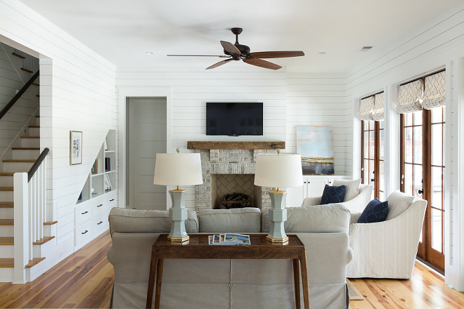 This living room feels perfect for this home Notice the whitewashed brick fireplace and the built-in cabinet/shelves on the left