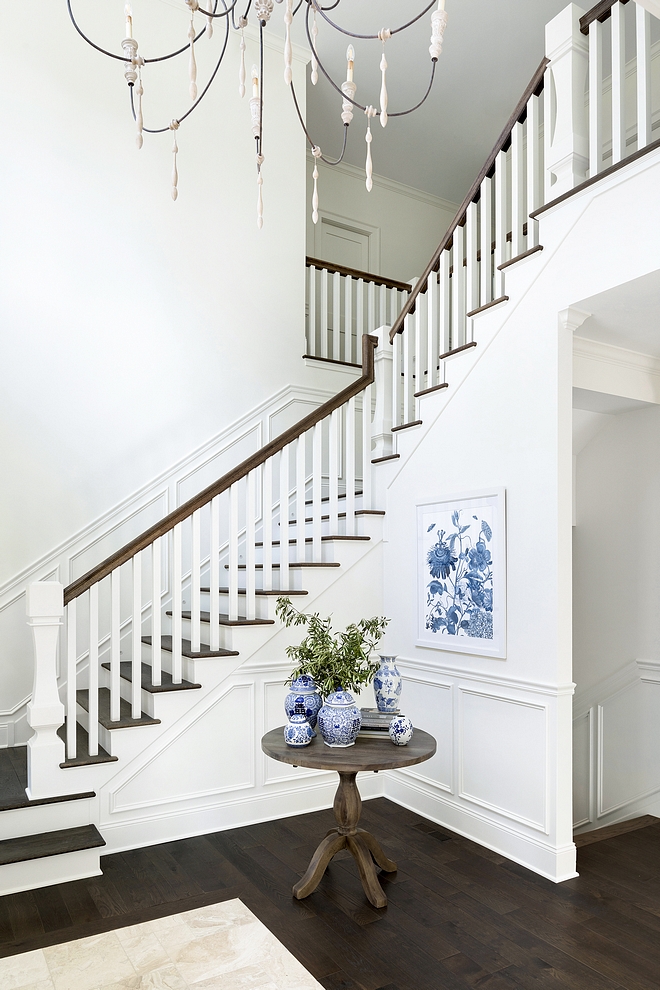 Classic staircase with white paneling and hardwood threads This staircase is so timeless and perfectly sets the tone for the rest of the home Classic staircase with white paneling and hardwood threads