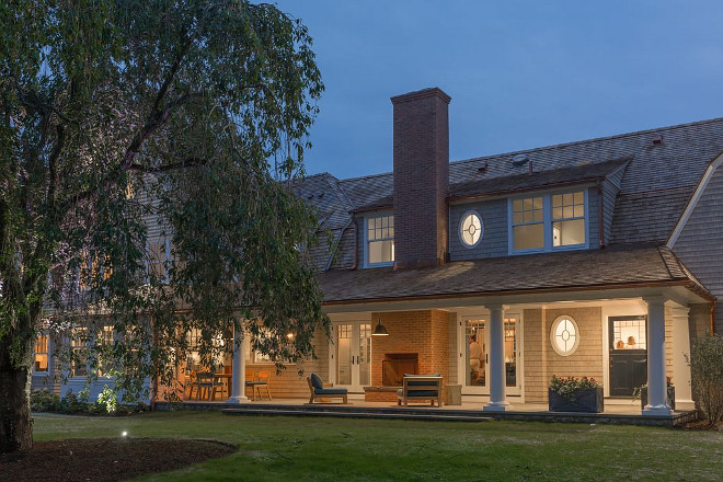 Shingle home Gorgeous patio with brick fireplace