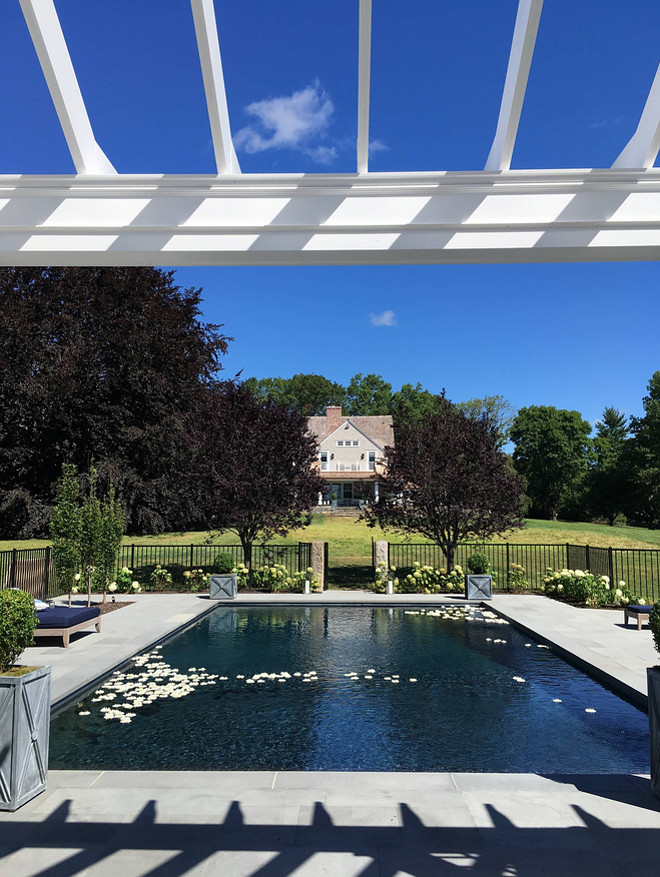 Backyard with pavillion and fenced pool area