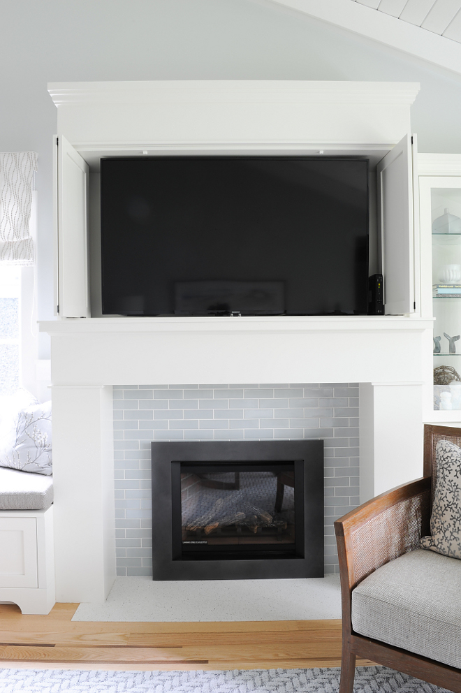 Hidden TV Fireplace Hidden TV The TV is carefully concealed in the custom millwork above the fireplace Hidden TV