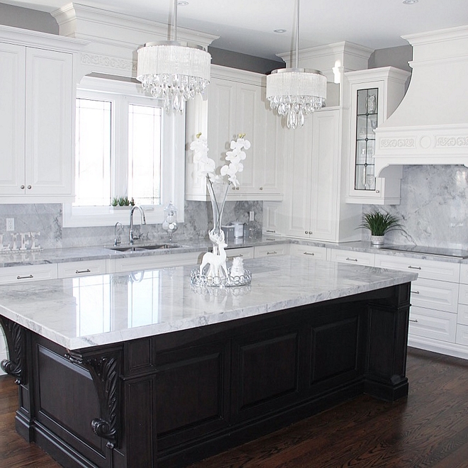 Walnut kitchen island with Superwihite quartzite countertop The island is almost 10 feet long by 4.5 ft wide The elegant corbels also add a touch of style