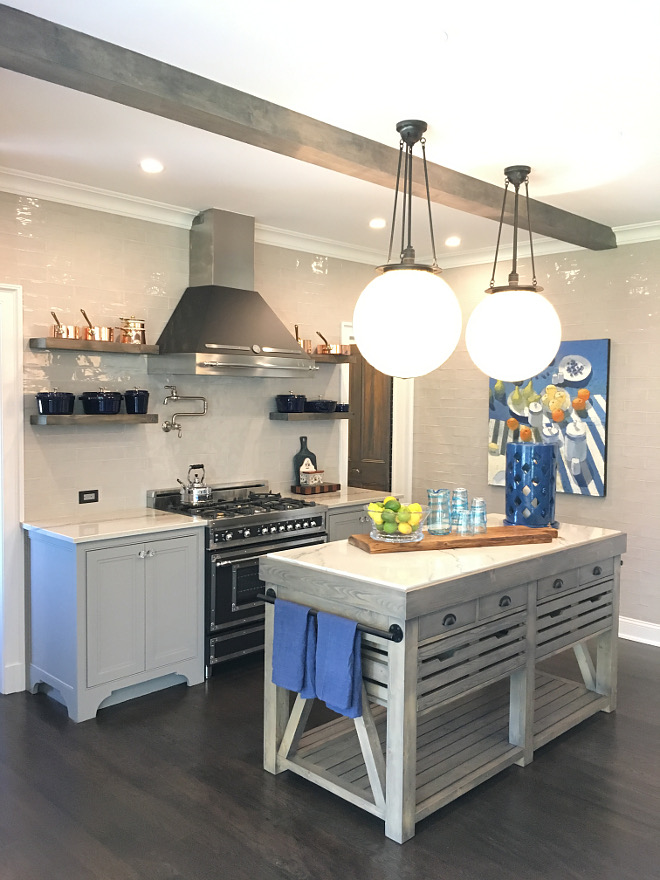 Kitchen with work island Kitchen with work island by range and floor to ceiling grey subway tile Kitchen with work island