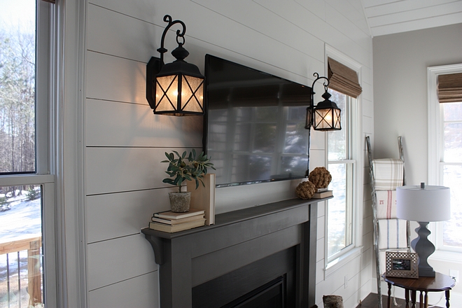 Fireplace sconces Sconces flanking fireplace against shiplap paneling Fireplace sconces