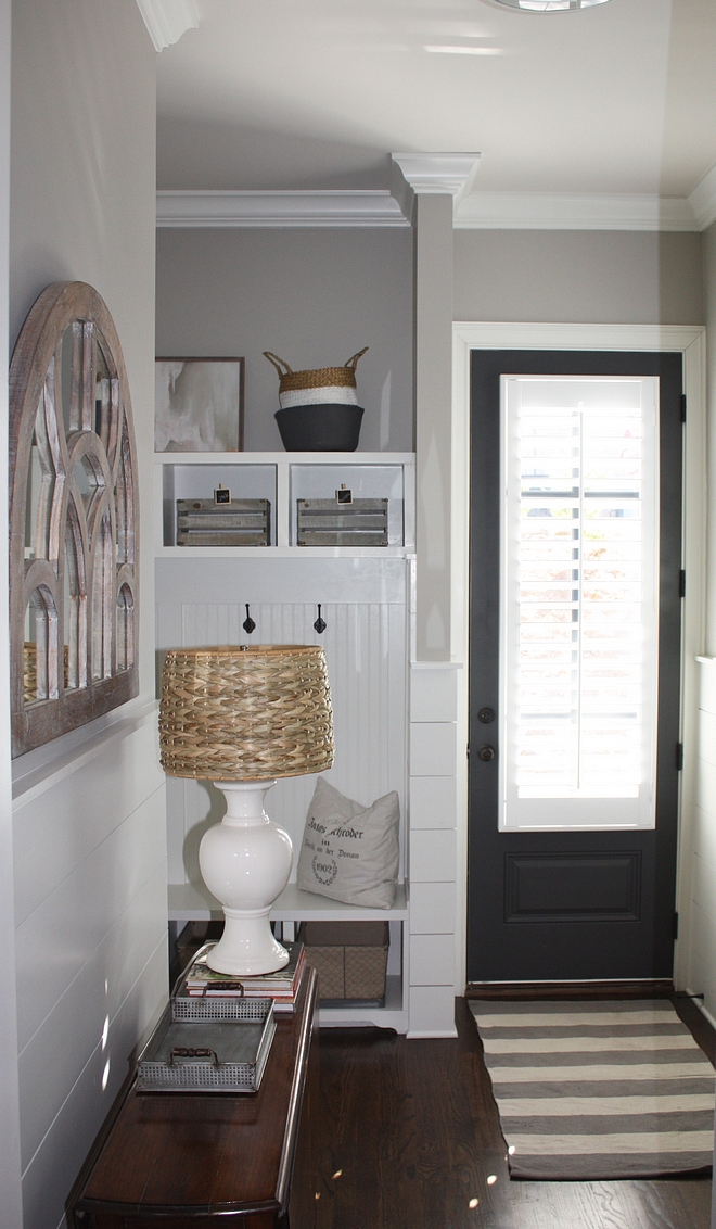 Mudroom with half wall shiplap and grey walls