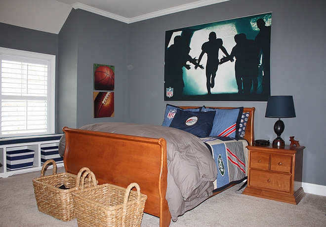 This is one of the boys' rooms Storage baskets at the end of the bed, as well as in the window built-ins makes keeping his room picked up a little easier