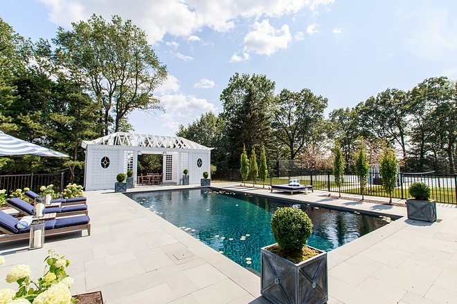 Pool area with sitting area and pergola structure