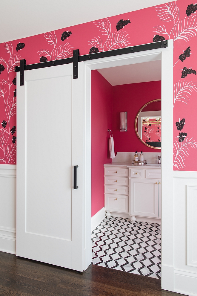 A white barn door, painted in BM Simply White, leads to the ensuite