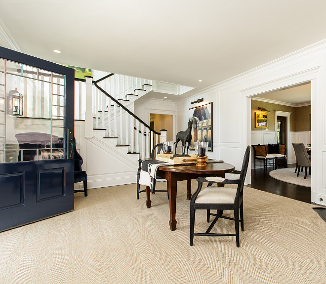 Traditional Foyer with navy blue front door