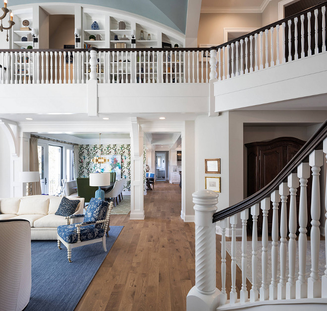 Two story living room with library on landing Two story living room with library on landing Two story living room with library on landing