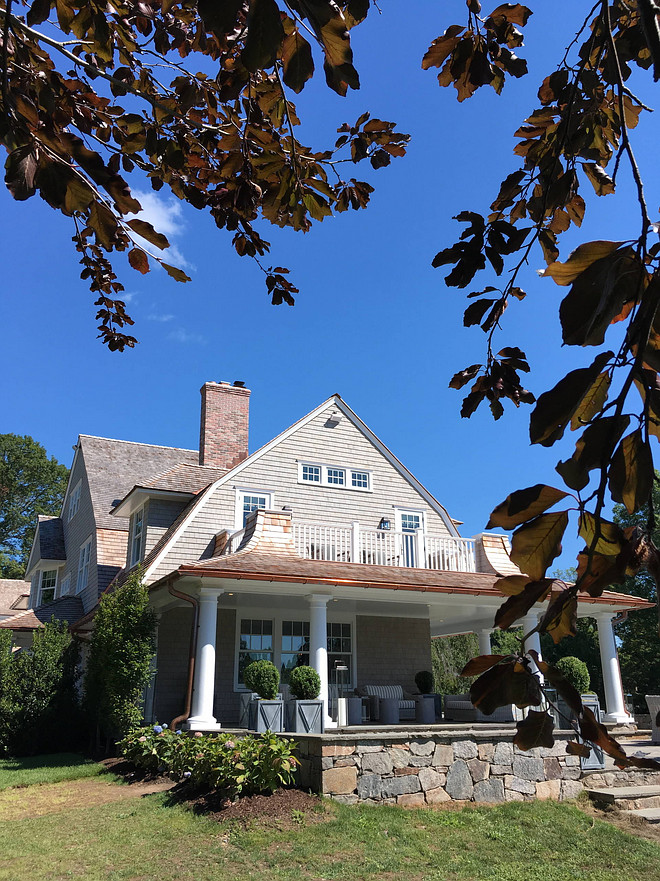 View of the side elevation with master bedroom walk-out terrace, porches and and stone patios Architectural Details