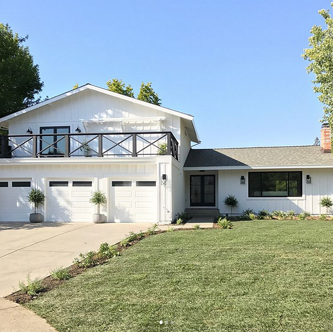 White exterior with black windows and black railing