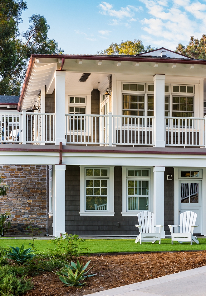 Grey shingle home with white trim and white windows Dark Grey shingle home with white trim white windows exterior stone veneer