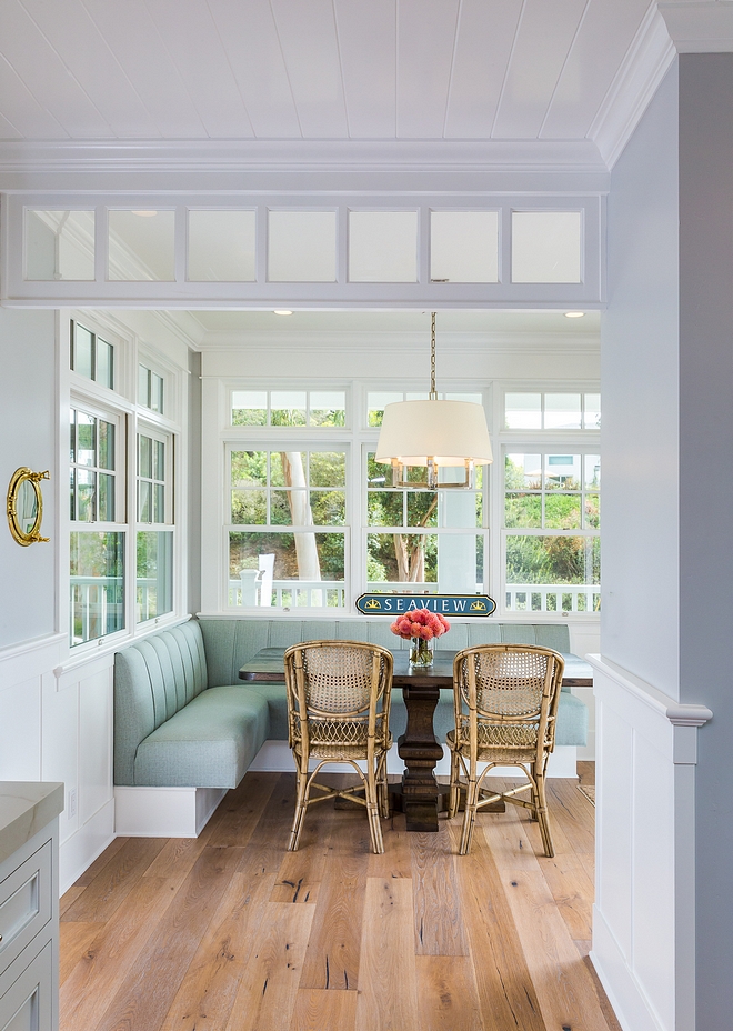 Breakfast room Leaving the kitchen, you will find a cozy breakfast room with hardwood floors, custom banquette and plenty of windows