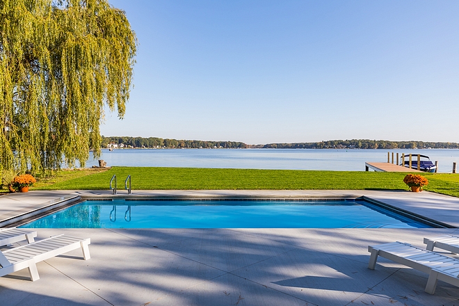 Lakehouse pool with concrete surround patio