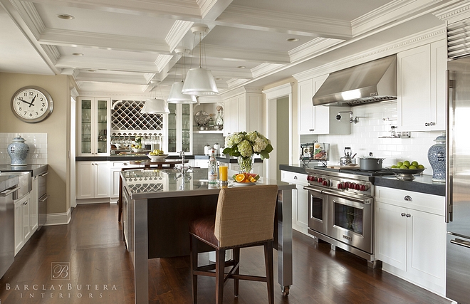 Traditional White Kitchen Traditional kitchen This traditional white kitchen features a handy movable island and beautiful millwork