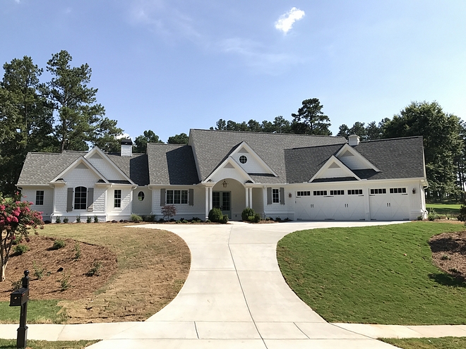 Beautiful white farmhouse with triple garage on a corner lot Modern farmhouse with triple garage on a corner lot Beautiful white farmhouse design with triple garage sources on Home Bunch