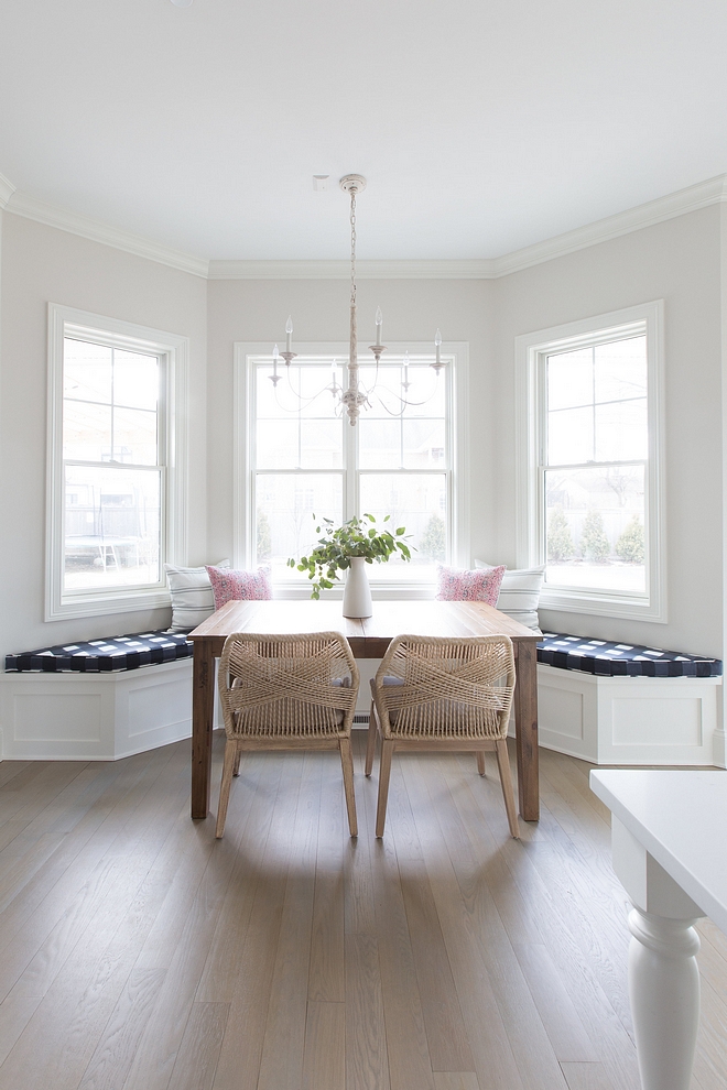 Kitchen nook kitchen nook with builtin banquette with Buffalo Check cushion French chandelier and rope wrapped dining chairs Paint color is Benjamin Moore Classic Gray