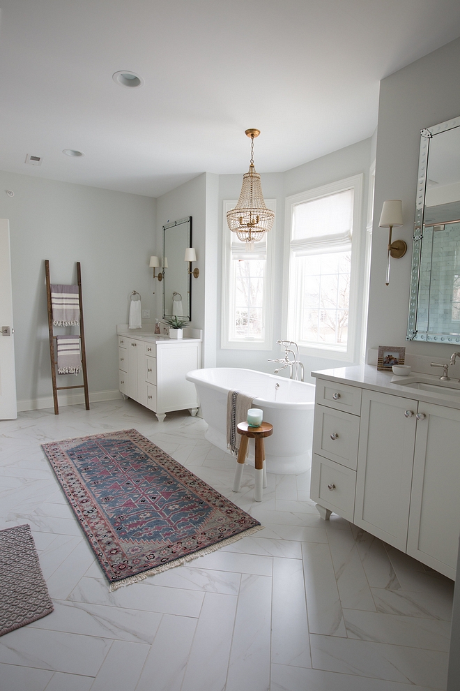 Herringbone bathroom tile Herringbone bathroom floor tile The tile floor is actually a porcelain that looks like marble, but of course without the maintenance or cost We cut them in half and laid them in a pretty herringbone pattern