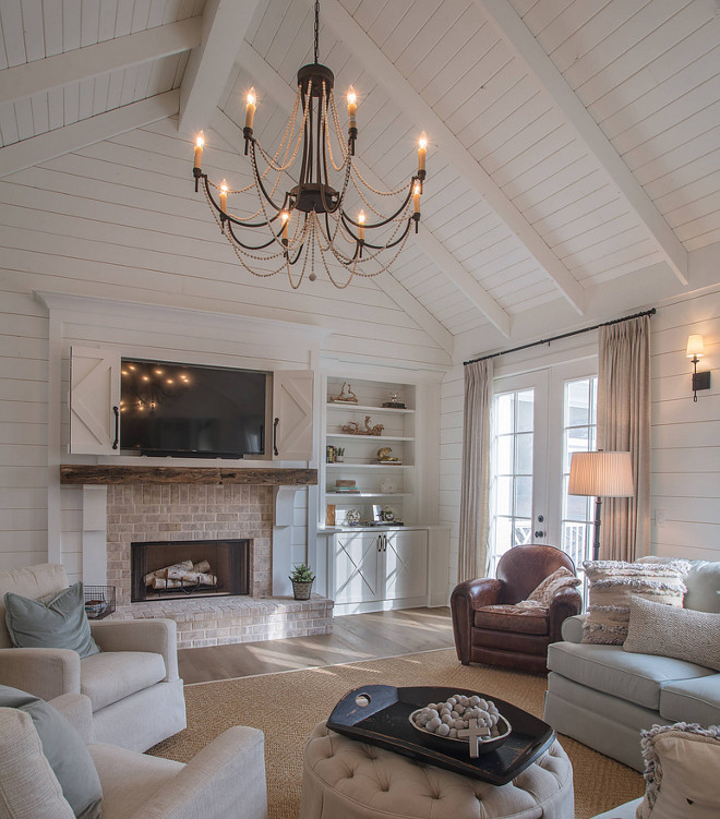 Farmhouse Living Room Fireplace with hidden TV Cabinet Above Fireplace