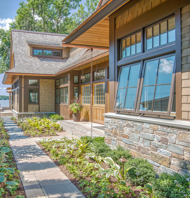 Exterior Home Stone at base and terrace Glacier Stone (quarry) full depth veneer ‘Loon Lake’ granite Random Ashlar